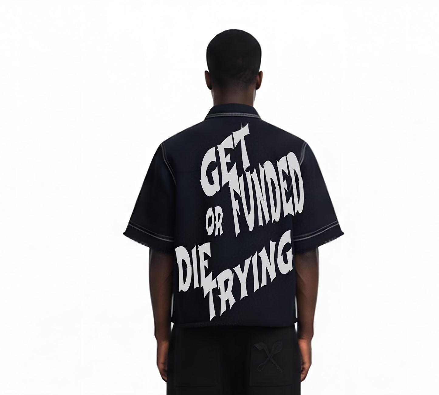 Person wearing a black shirt with white text on the back, standing against a white background